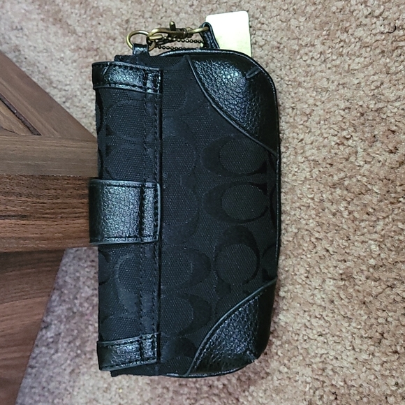 - Coach wristlet black super cute large enough for phone. - Picture 11 of 16